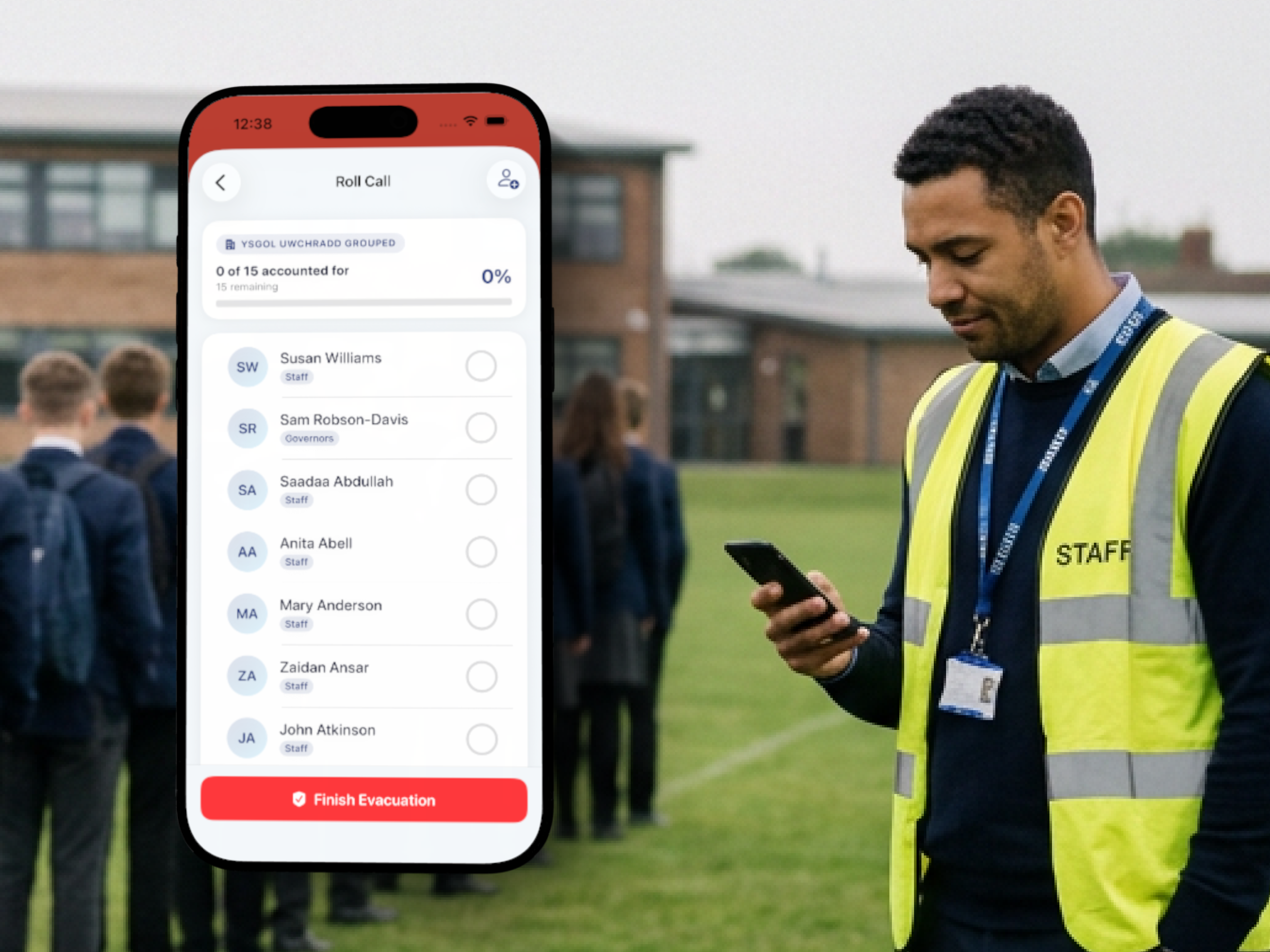A staff member in a high-visibility vest using OnSite Evacuation on a phone during a roll call